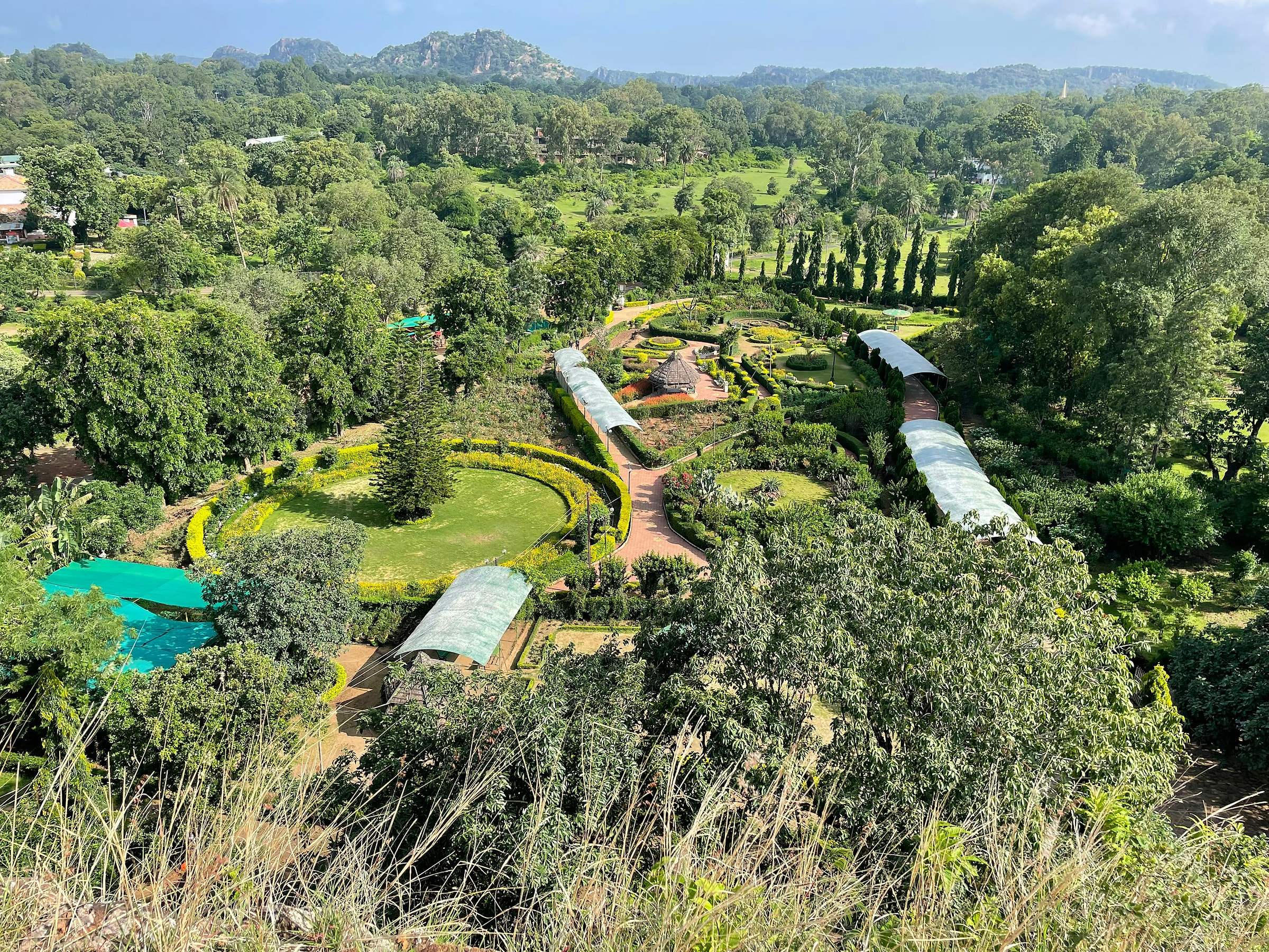 Pachmarhi from above: gardens and buildings among dense green forest