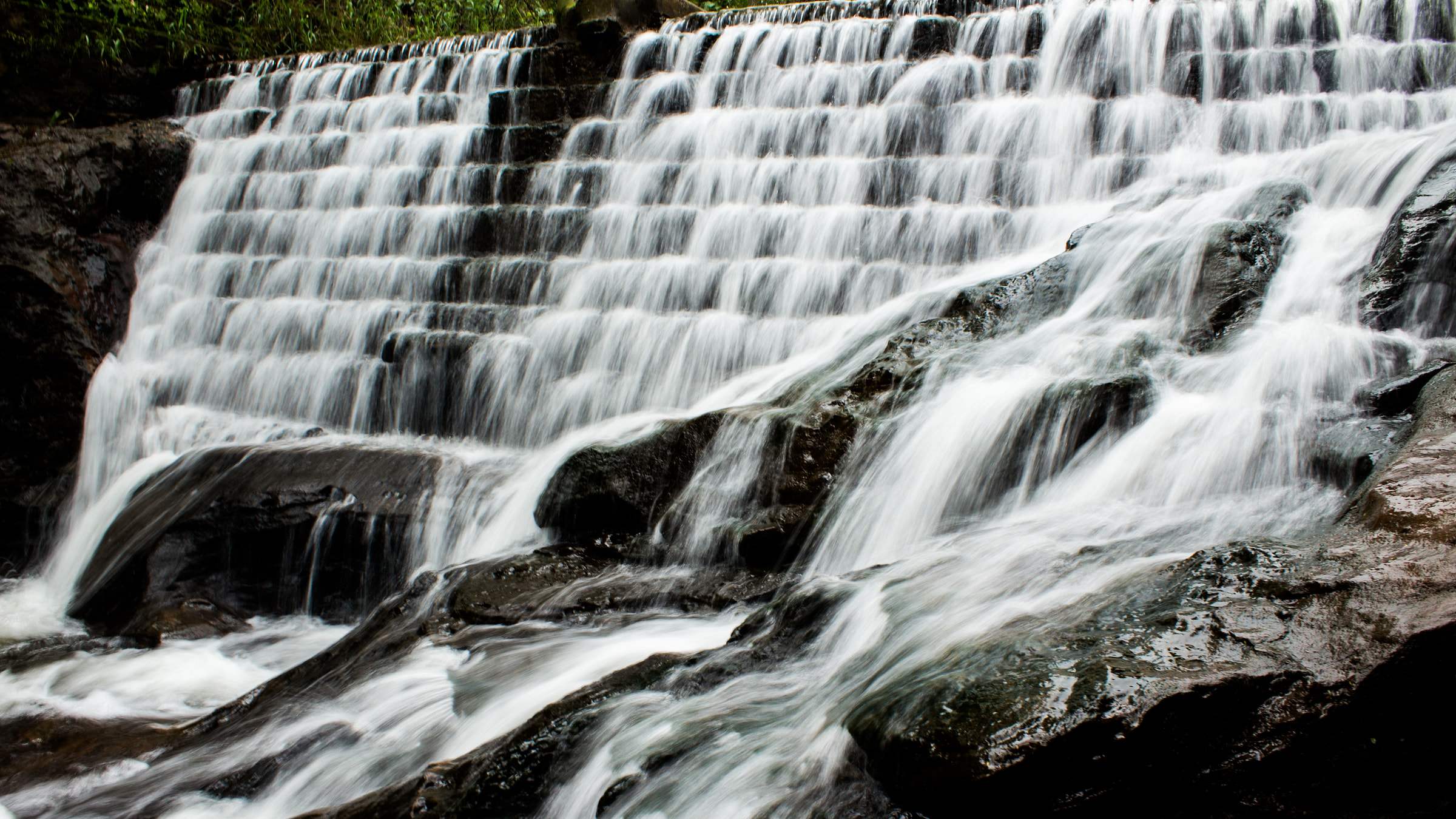 Water spilling in silky layers down the rocks at Bee Fall